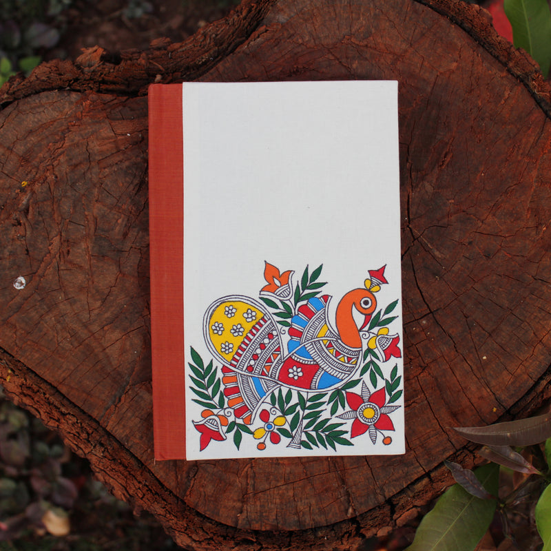 Handpainted notebook depicting Madhubani art. The peacock motif has been painted on the cover by a Madhubani artist from Bihar.